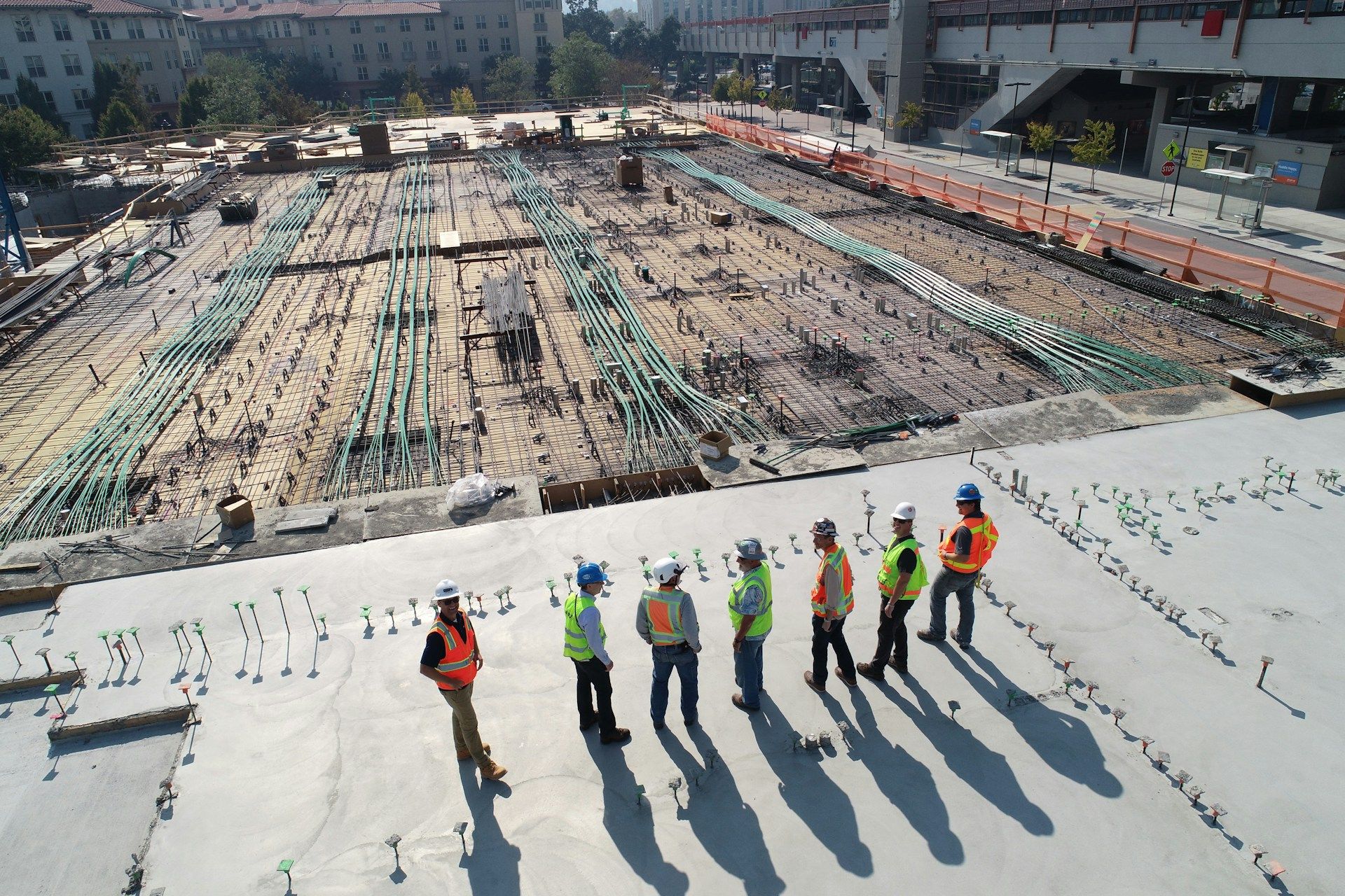 Site team reviewing a reinforced concrete slab on a civil construction project